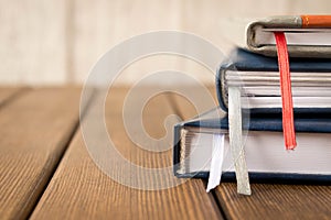 Several notebooks on a wooden table. Business supplies. Close up
