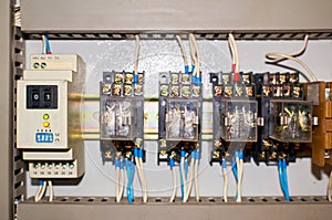 Several old relays with connected colored wires.