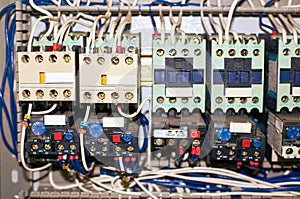 Several old relays with connected colored wires.