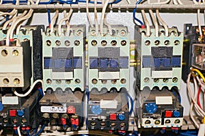 Several old relays with connected colored wires.