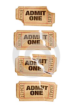 Several old torn and stained admit one movie tickets, white background, close up