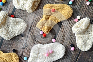 Several pairs of handmade woolen socks for newborn