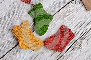 Several pairs of handmade woolen socks for newborn