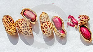 Peanuts in Shells Opened Showing Red.