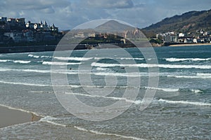 Several People Practicing Kayak On The Beach Of La Concha In San Sebastian. Sport Travel Nature.