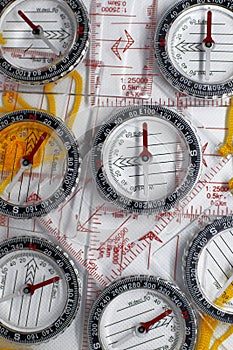 Several plastic transparent compasses