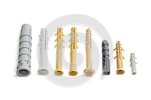 Several plastic wall plugs on light background