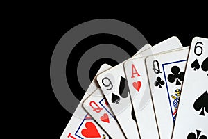 Several playing cards on a dark background c