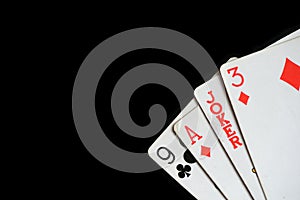 Several playing cards on a dark background c