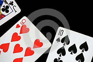 Several playing cards on a dark background c
