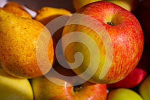 Several red-green apples standing on top of each other