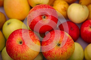 Several red-green apples standing on top of each other