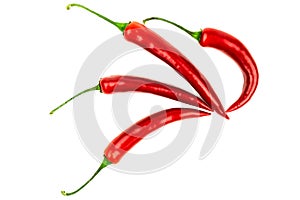 Several red hot peppers on a white background