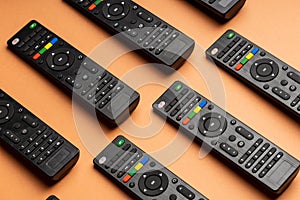 Several remote controls for TVs. lined up remotes for tv