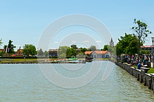 several rowing boats are waiting for their customers on shore of the neusiedlersee lake in Austria....IMAGE