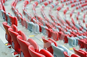 Several rows of red and white stadium seats