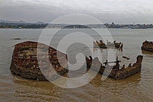Several rusting Wrecks of boats lie abandoned on Sao Tome Island
