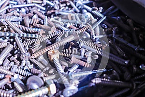 Several screws piled up in the workshop