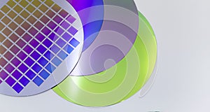 Several silicon wafers with printed circuit and different color.White background