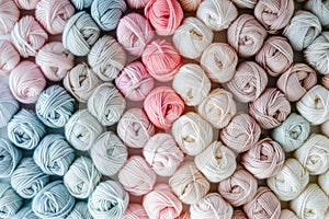 Several skeins of white and pink yarn