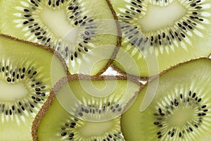 Several slices of a cut kiwi fruit