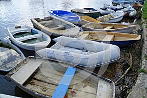 Several small boat dinghies moored in harbour