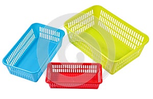 Several small different colored plastic baskets for household us