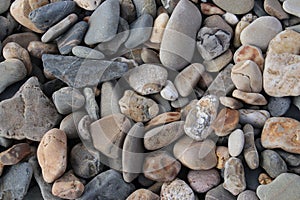 Several small stones at shore line on the harbor of Rotterdam in the Netherlands