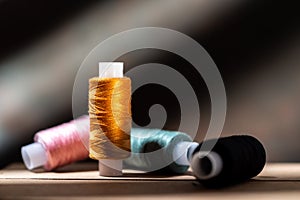 Several spools of thread. Multi-colored spools of thread. Thread for seamstresses.