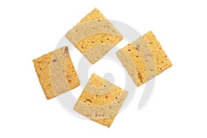 Several square crackers. Carbohydrate snack. Isolated on white background