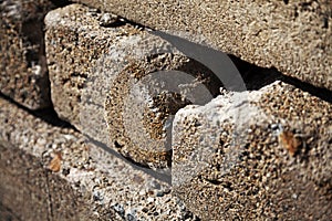 Several stacked rectangular boulders in a pile