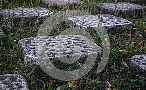 Several stone checkers and grass in-between