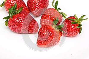 several strawberries on a white background side view studio shot isolate 1