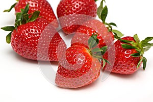 several strawberries on a white background side view studio shot isolate 2
