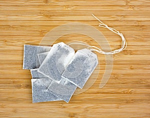 Several teabags on wood photo