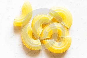 Several uncooked chifferini rigati pasta pieces
