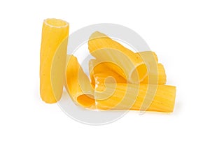 Several uncooked tortiglioni pasta close-up on a white background
