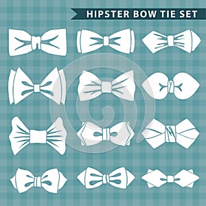Several white silhouettes of bow tie.Hipster fashion