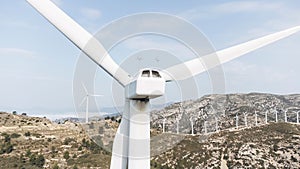 several wind turbine blades are on the side of a hill