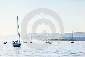 Several yachts with one in front,