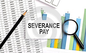 SEVERANCE PAY text on white card on the chart background