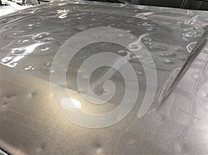 Severe hail damage on car