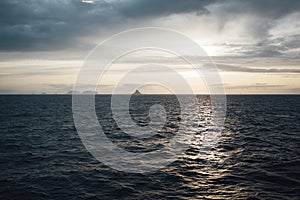 Severe landscape of rock in the distance among sea