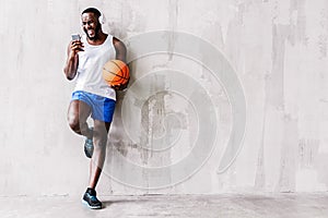 Severe young african sportsman with beard having relax time