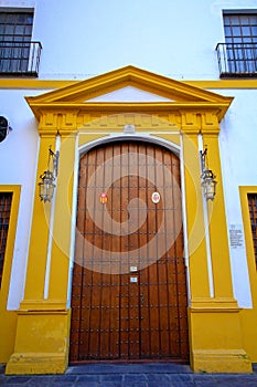 Sevilla, Spain. Beautiful view of a main gate of a tipical andalucian building photo