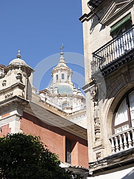 SEVILLA, SPAIN City view with Seville Cathedral and Giralda tower. Spring in Calle Mateos Gago street.