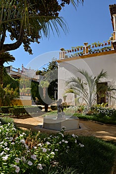 Seville, Andalusia, Spain. Inner court garden at the Casa de Pilatos