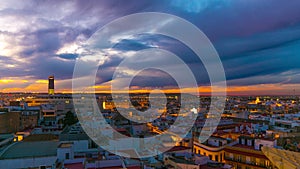 Seville beautiful sunset city panorama from the roof top 4k time lapse spain