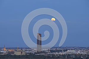 Seville\'s Nocturnal Splendor: Giralda and Sevilla Tower Bathed in Moonligh