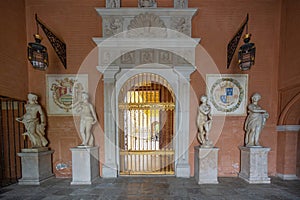 Golden door with statues at Casa de Pilatos (Pilates House) Palace Interior - Seville, Andalusia, Spain